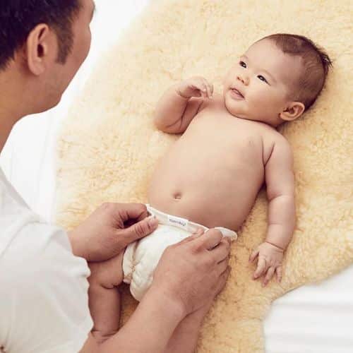 dad diapering baby