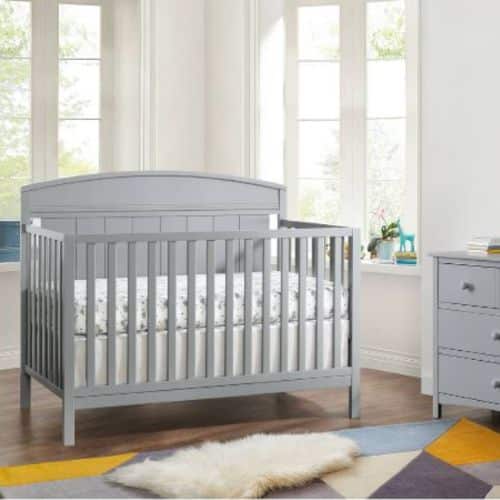 grey crib in a nursery