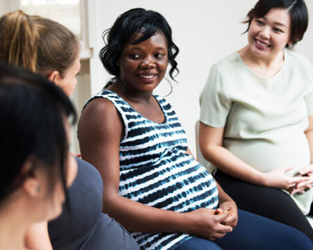 group of pregnant women talking