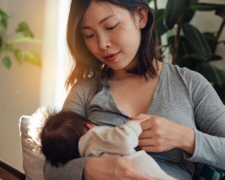 mother breastfeeding baby at home regular breastfeeding is helpful for mastitis management