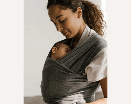 mom wearing baby in a baby wrap
