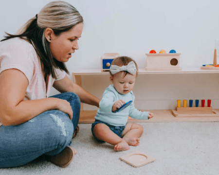 mom using montessori baby principles to play with her child at home