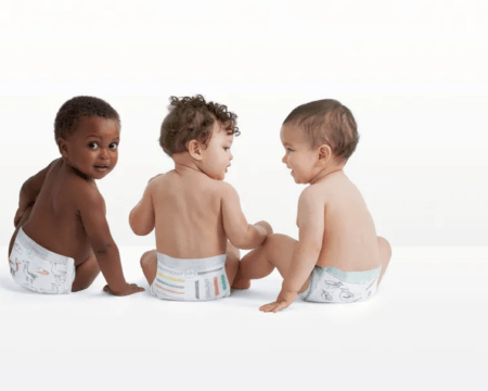 three babies wearing natural diapers in photography studio